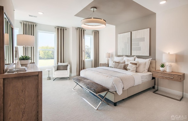 bedroom with light colored carpet