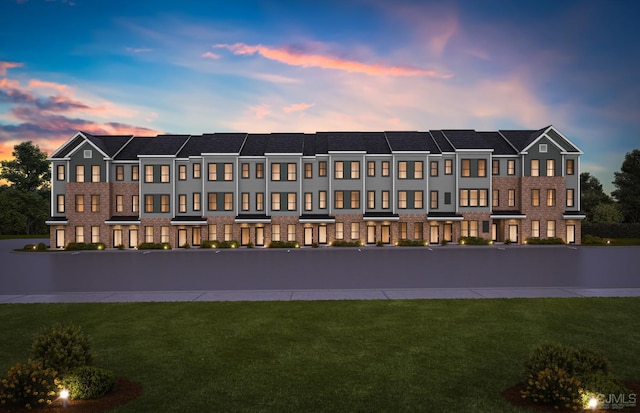 view of outdoor building at dusk