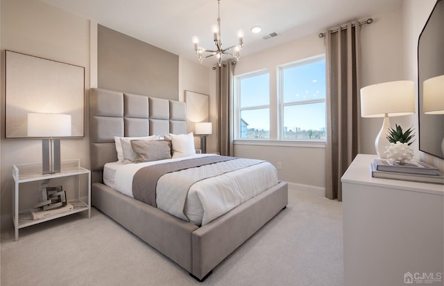 carpeted bedroom with a chandelier