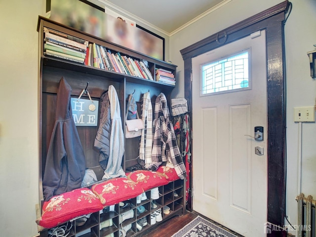 381 Keene St, Perth Amboy, NJ 08861 - mudroom with crown molding, wood finished floors, and radiator
