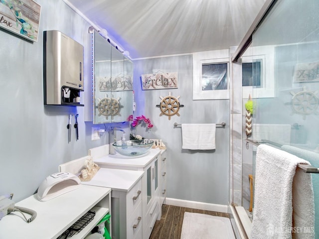 381 Keene St, Perth Amboy, NJ 08861 - bathroom featuring vanity, a shower stall, and wood finished floors