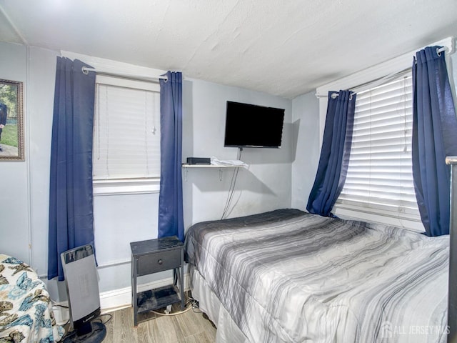 381 Keene St, Perth Amboy, NJ 08861 - bedroom featuring wood finished floors