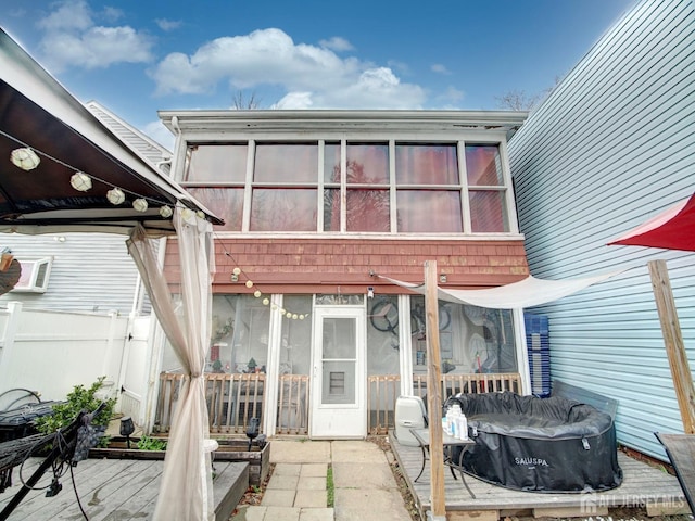 381 Keene St, Perth Amboy, NJ 08861 - rear view of property featuring a sunroom and a wooden deck