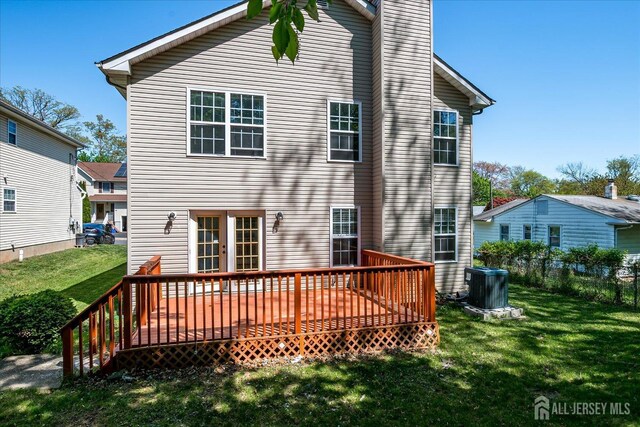 230 S 10th Ave S, Highland Park, NJ 08904 - rear view of property featuring a wooden deck and a chimney