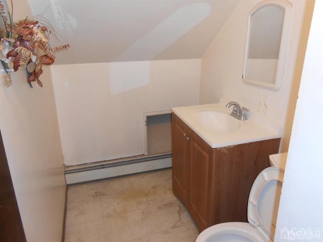 bathroom with baseboard heating, toilet, and vanity