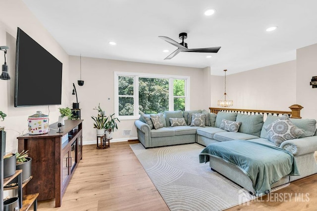24 Bentley Rd, Monroe, NJ 08831 - living room featuring ceiling fan, light wood-type flooring, recessed lighting, a chandelier, and baseboards