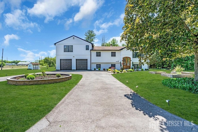 24 Bentley Rd, Monroe, NJ 08831 - view of front of home with driveway, a garage, and a front lawn