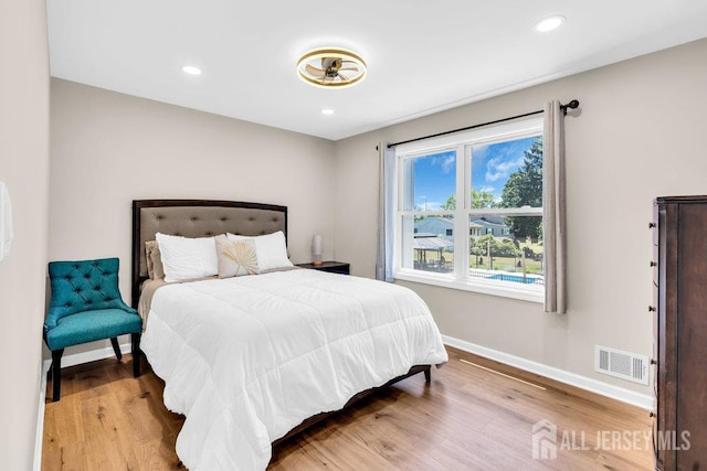 24 Bentley Rd, Monroe, NJ 08831 - bedroom with baseboards, wood finished floors, and recessed lighting