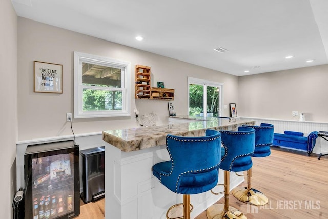 24 Bentley Rd, Monroe, NJ 08831 - bar area featuring light wood finished floors, recessed lighting, and wine cooler