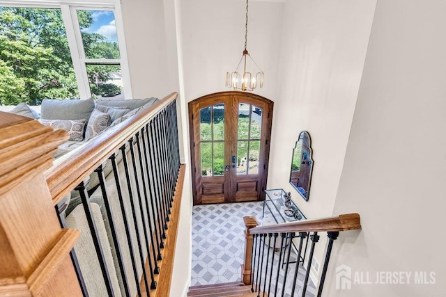 24 Bentley Rd, Monroe, NJ 08831 - entryway featuring a chandelier, healthy amount of natural light, french doors, and arched walkways