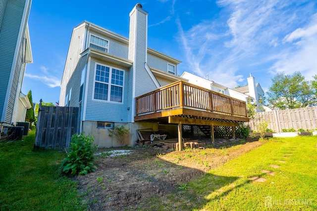 12 Elsie Dr, Plainsboro, NJ 08536 - back of property featuring a chimney and a wooden deck