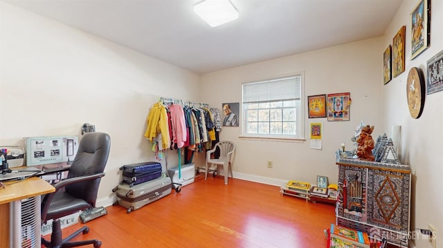 office with wood finished floors and baseboards