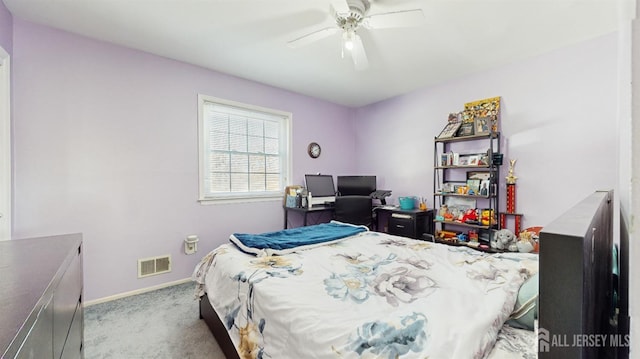 bedroom with baseboards, visible vents, a ceiling fan, and light colored carpet