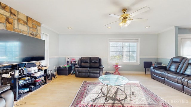 living room with recessed lighting, light wood-style flooring, ornamental molding, a ceiling fan, and baseboards