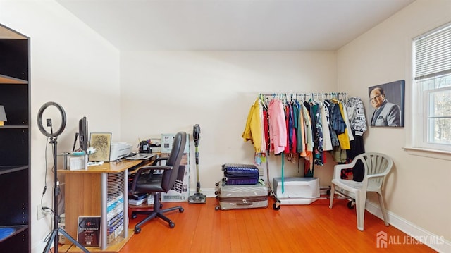 office featuring wood finished floors and baseboards