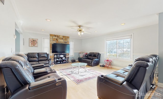 living area featuring ornamental molding, recessed lighting, baseboards, and a ceiling fan