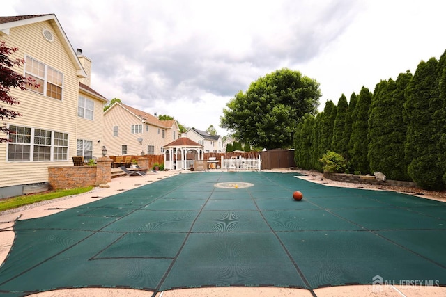 19 Crescent Rd, Old Bridge, NJ 08857 - view of swimming pool with a gazebo, a covered pool, a residential view, and a patio