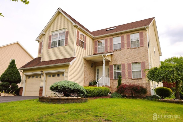 19 Crescent Rd, Old Bridge, NJ 08857 - view of front of house featuring a garage, brick siding, a front yard, and asphalt driveway