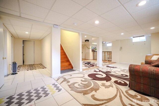 19 Crescent Rd, Old Bridge, NJ 08857 - below grade area featuring stairs, tile patterned flooring, a paneled ceiling, recessed lighting, and baseboards