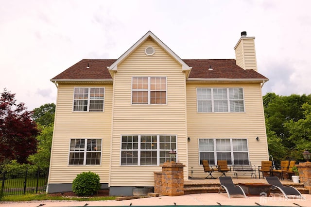 19 Crescent Rd, Old Bridge, NJ 08857 - rear view of house featuring a patio and a chimney