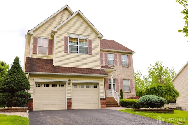 19 Crescent Rd, Old Bridge, NJ 08857 - view of front of house featuring driveway, a garage, and brick siding