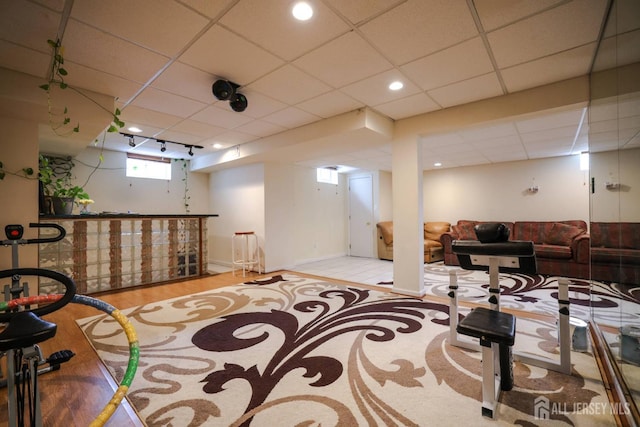 19 Crescent Rd, Old Bridge, NJ 08857 - basement with a dry bar, a paneled ceiling, and wood finished floors