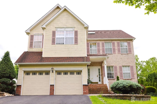 19 Crescent Rd, Old Bridge, NJ 08857 - view of front of property featuring asphalt driveway, a garage, and brick siding