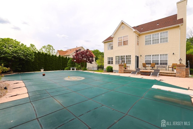 19 Crescent Rd, Old Bridge, NJ 08857 - view of swimming pool with a patio area, a diving board, and a covered pool