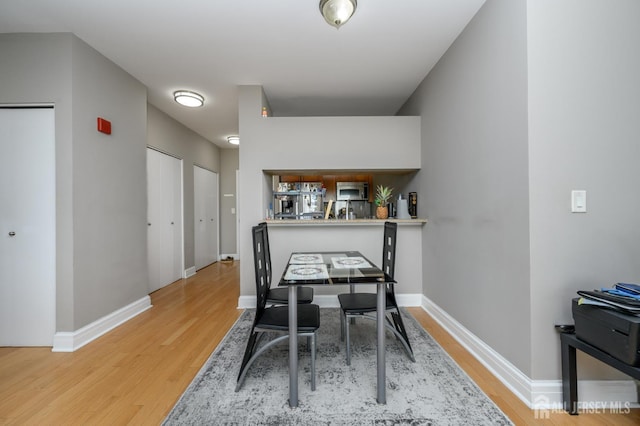1 Spring St Unit 1206, New Brunswick, NJ 08901 - dining space featuring light wood-style flooring and baseboards