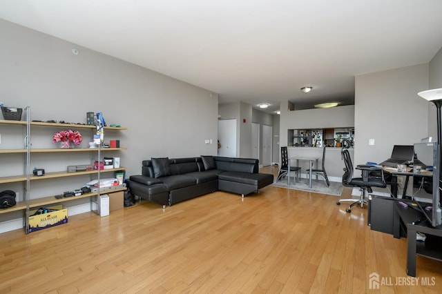1 Spring St Unit 1206, New Brunswick, NJ 08901 - living area featuring light wood-style floors and a desk