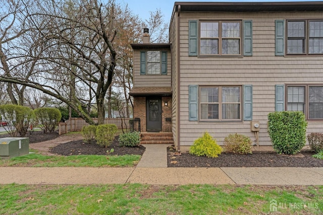 1 Pheasant Run, Edison, NJ 08820 - view of front facade with fence and a chimney