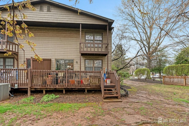 1 Pheasant Run, Edison, NJ 08820 - rear view of house with central AC unit, fence, a deck, and a balcony