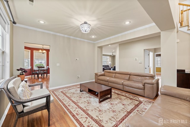 55 Dahlia Ct, Piscataway, NJ 08854 - living room featuring a chandelier, wood finished floors, ornamental molding, and recessed lighting