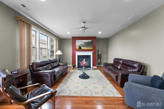 55 Dahlia Ct, Piscataway, NJ 08854 - living area with ceiling fan, wood finished floors, recessed lighting, and a fireplace with flush hearth