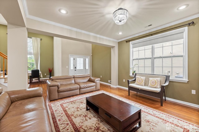 55 Dahlia Ct, Piscataway, NJ 08854 - living area with crown molding, wood finished floors, healthy amount of natural light, a chandelier, and stairs