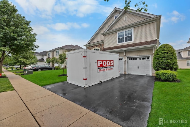 55 Dahlia Ct, Piscataway, NJ 08854 - view of front of property with a garage, a front yard, and driveway