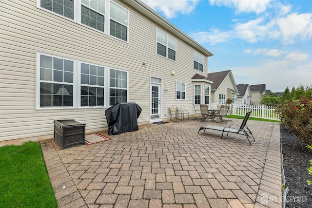 55 Dahlia Ct, Piscataway, NJ 08854 - view of patio featuring a grill, outdoor dining area, and a residential view