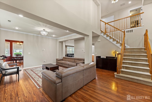 55 Dahlia Ct, Piscataway, NJ 08854 - living room with wood finished floors, stairs, crown molding, recessed lighting, and a chandelier