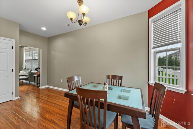 55 Dahlia Ct, Piscataway, NJ 08854 - dining space with healthy amount of natural light, wood finished floors, a chandelier, and recessed lighting