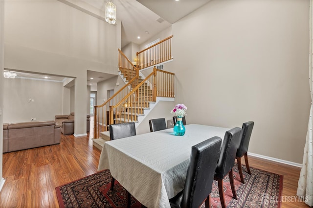 55 Dahlia Ct, Piscataway, NJ 08854 - dining room with stairway, wood finished floors, a towering ceiling, and recessed lighting