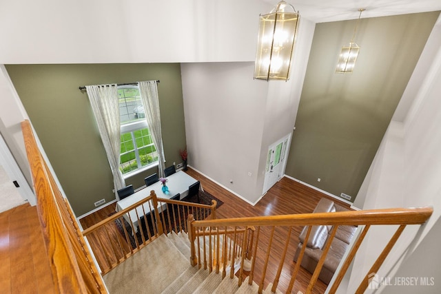 55 Dahlia Ct, Piscataway, NJ 08854 - stairway featuring wood finished floors and baseboards