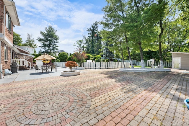 view of patio / terrace featuring outdoor dining space and fence private yard