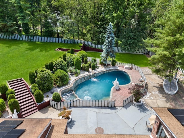 view of pool with a yard, a patio area, and pool water feature