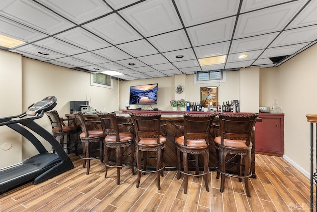 bar featuring light hardwood / wood-style floors