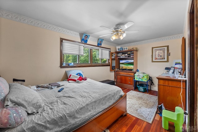 bedroom featuring hardwood / wood-style flooring and ceiling fan