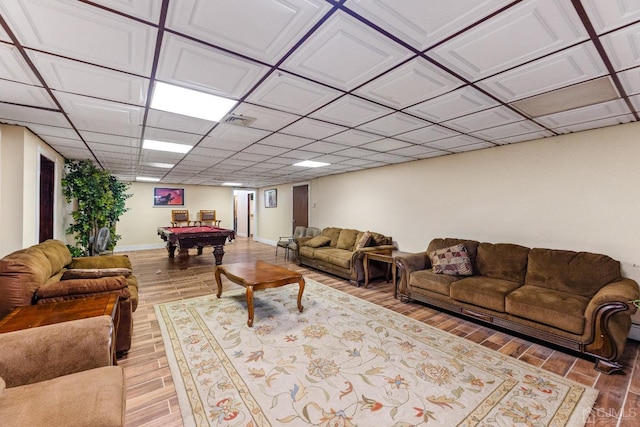 living room featuring a drop ceiling, pool table, and hardwood / wood-style flooring