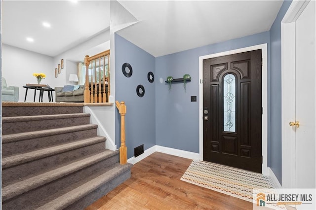 34 Connor Ave, Metuchen, NJ 08840 - entryway with wood finished floors, stairway, and recessed lighting
