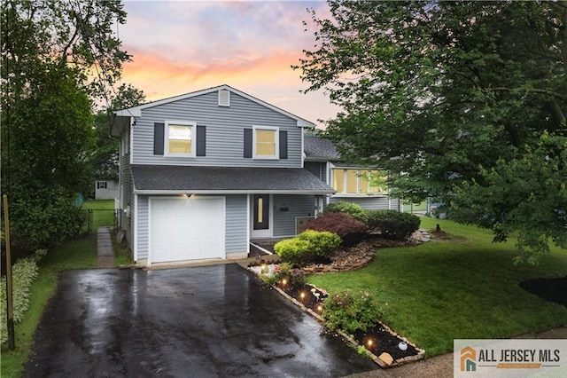 34 Connor Ave, Metuchen, NJ 08840 - split level home with asphalt driveway, a front lawn, an attached garage, and a shingled roof