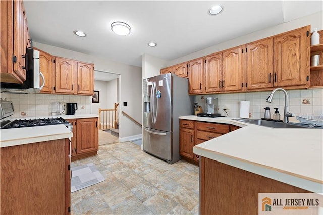 34 Connor Ave, Metuchen, NJ 08840 - kitchen featuring stainless steel refrigerator with ice dispenser, tasteful backsplash, gas range, open shelves, and light countertops