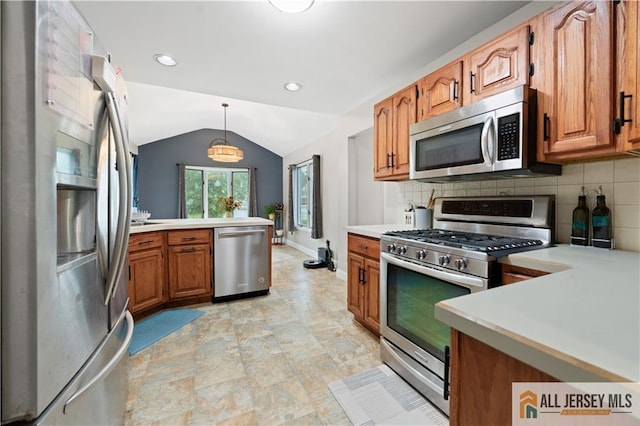 34 Connor Ave, Metuchen, NJ 08840 - kitchen with stainless steel appliances, brown cabinetry, light countertops, lofted ceiling, and decorative backsplash